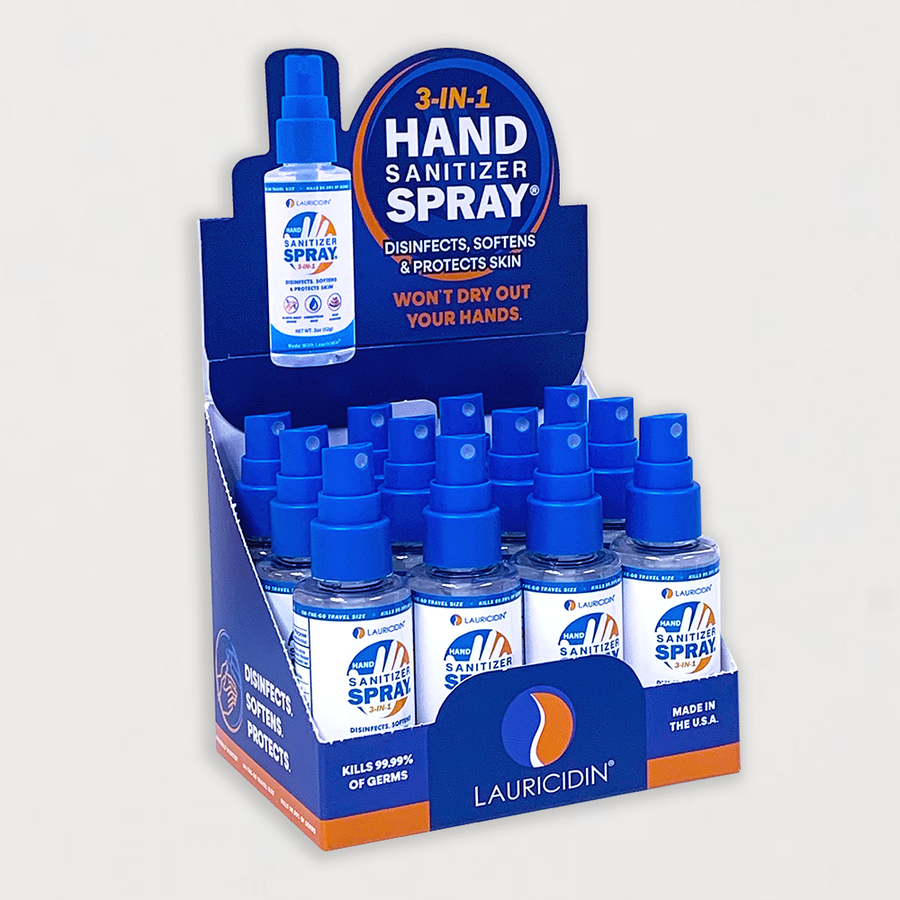 A display box containing multiple bottles of Hand Sanitizer Spray with the brand name LAURICIDIN.