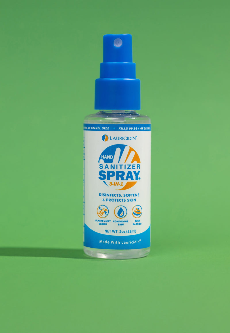Bottle of A+ Aloe Sanitizer Spray on a green background