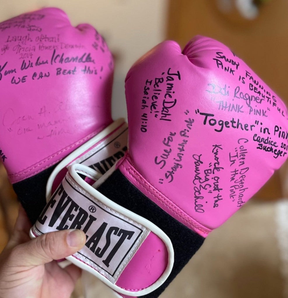 A close look at Betty's signed pink Everlast boxing gloves.
